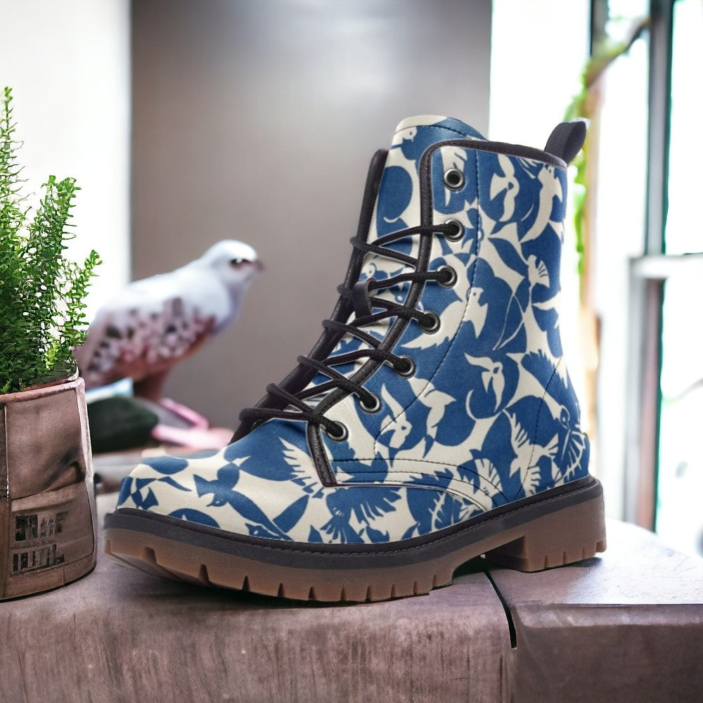 a pair of blue and white boots sitting on top of a table