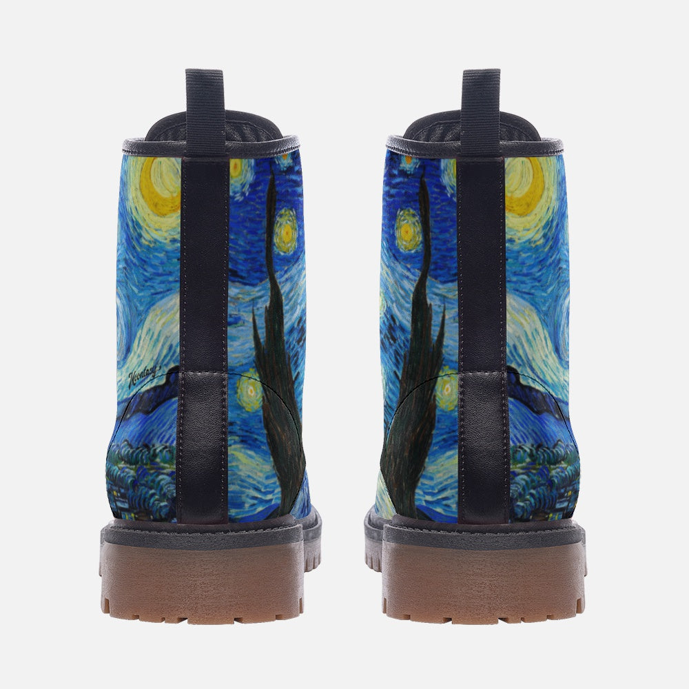 a pair of boots with a painting on them