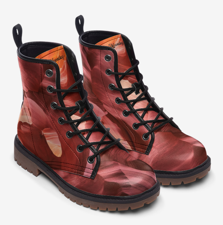 a pair of red boots with black laces