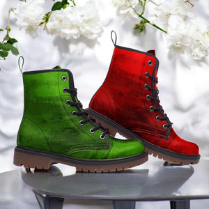 A pair of green and red combat boots are displayed against a white background with white flowers.