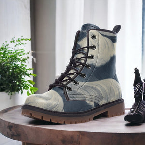 a pair of boots sitting on top of a wooden table