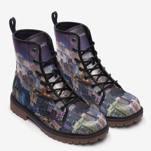 a pair of boots with a picture of a city