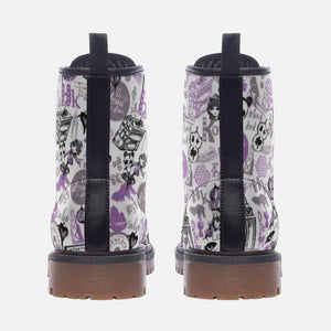 a pair of white and purple boots with black straps