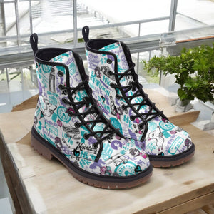 a pair of boots sitting on top of a wooden table