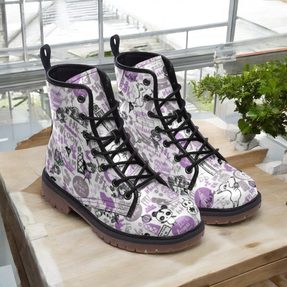 a pair of white and purple boots sitting on top of a wooden table