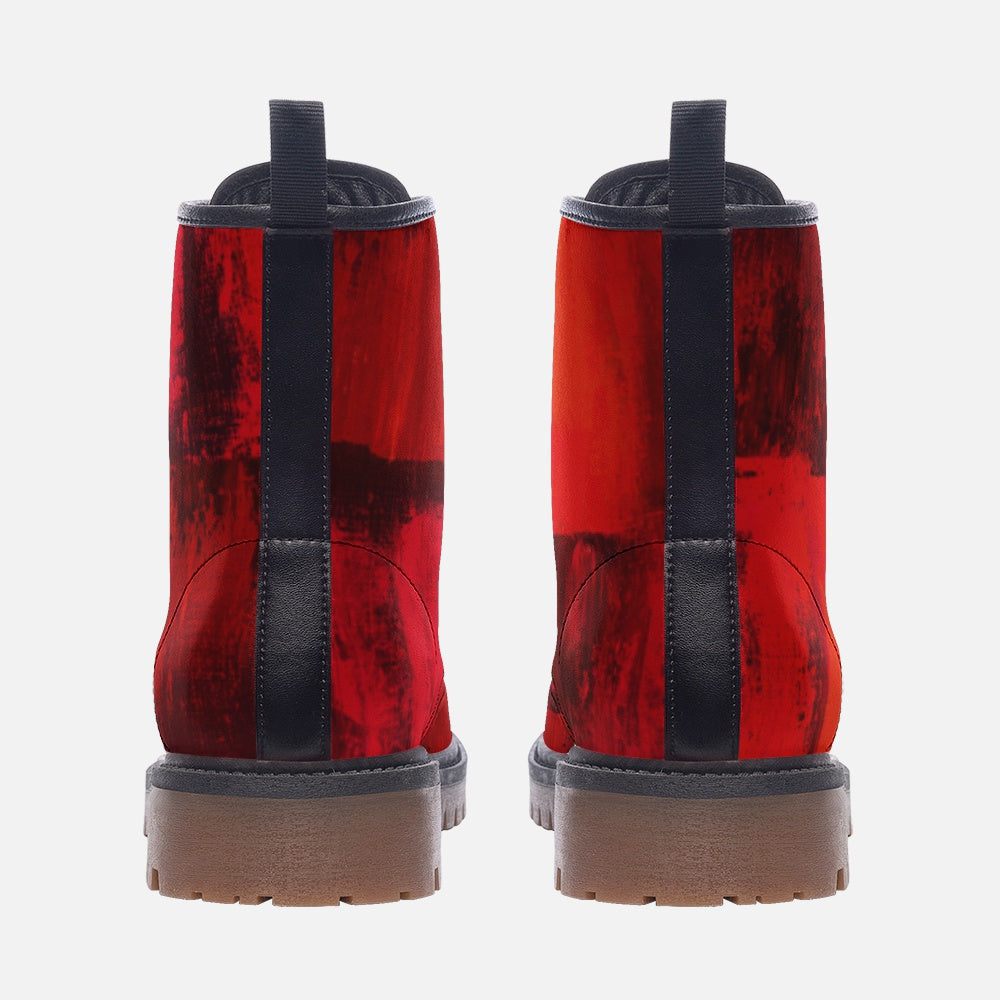 a pair of red and black boots on a white background
