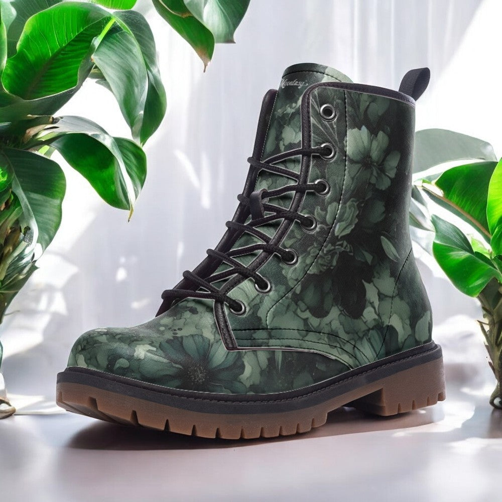 a pair of green boots with flowers on them
