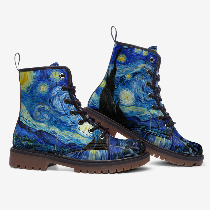 a pair of blue boots with a painting on them