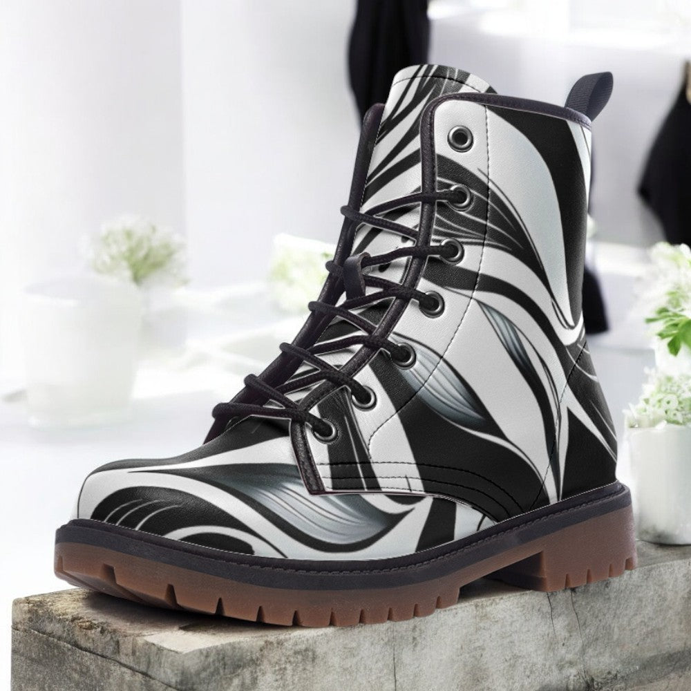 a pair of black and white boots sitting on top of a cement block