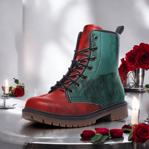 A red and green boot is displayed on a table, surrounded by red roses and lit candles.
