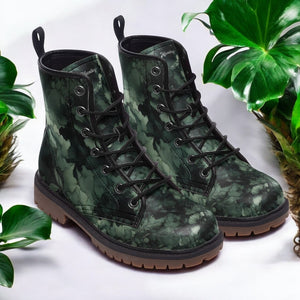 a pair of green boots sitting on top of a table