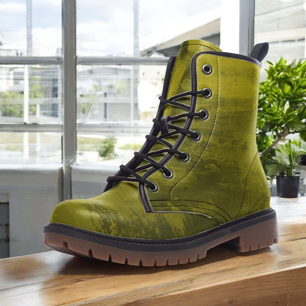 A lime green, textured boot is displayed on a wooden surface, with a window and potted plant visible in the background.