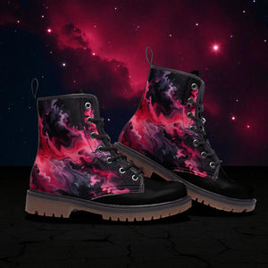 A pair of black and pink boots with a vibrant, swirling galaxy design on the side, set against a dark, starry background.