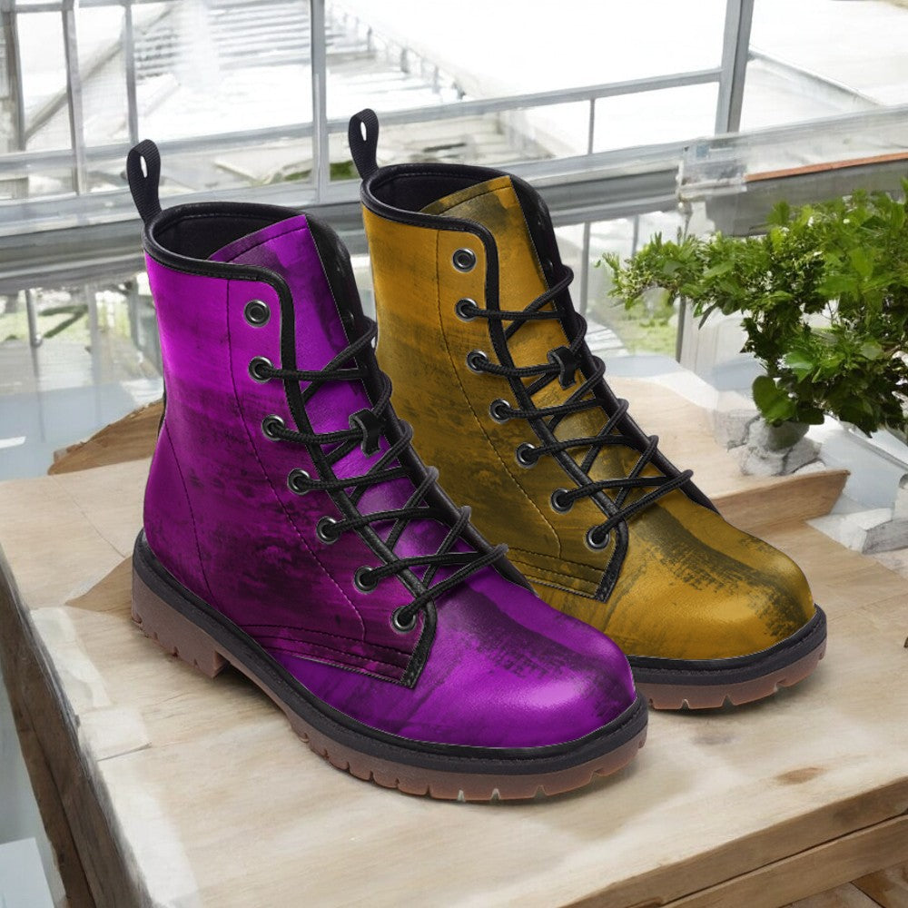 a pair of colorful boots sitting on top of a wooden table