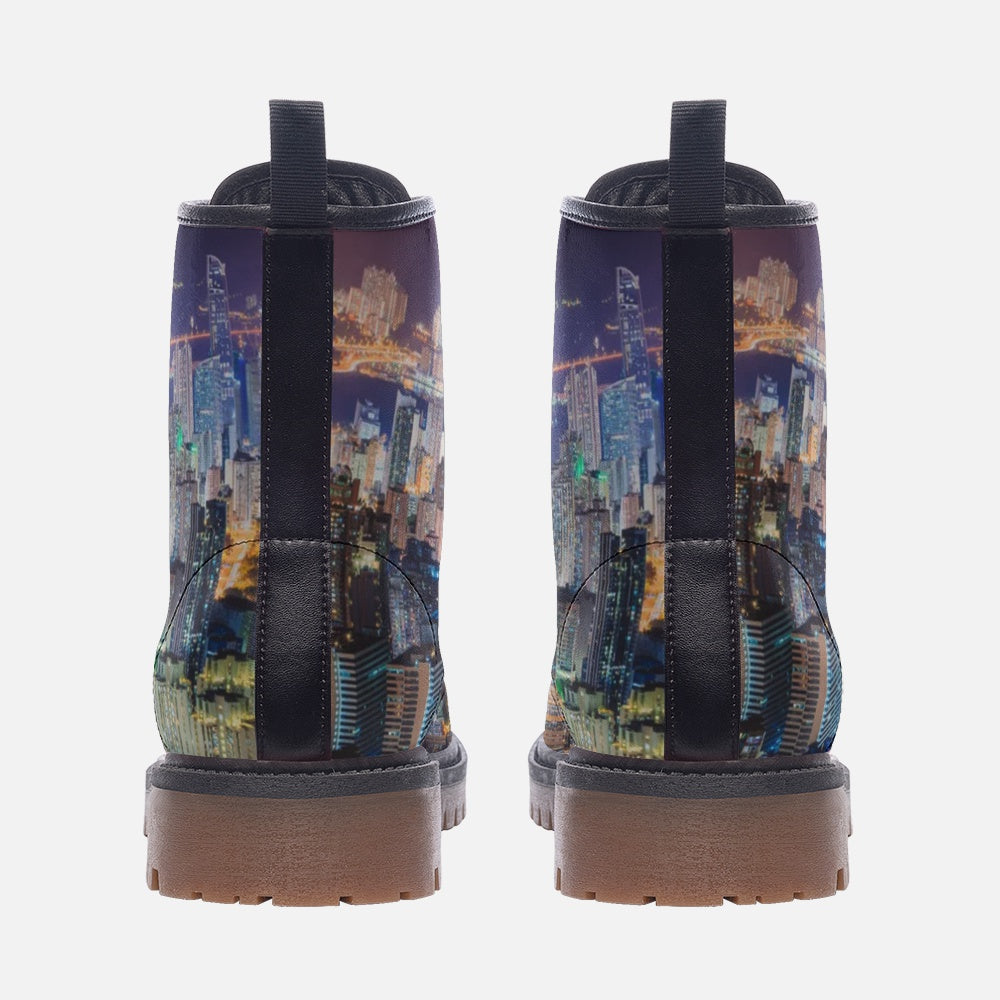 a pair of boots with a picture of a city