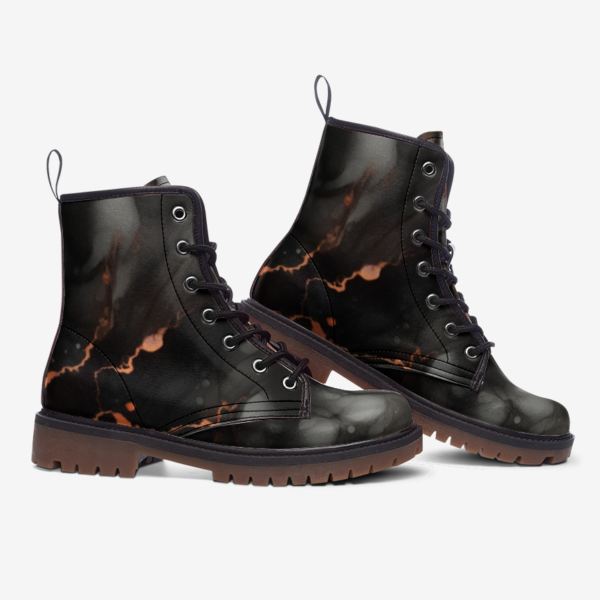 a pair of black boots with a marble pattern