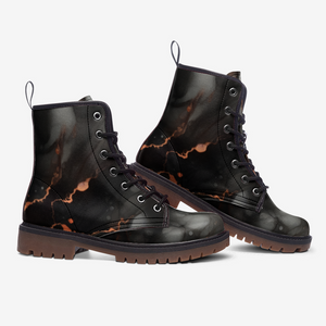 a pair of black boots with a marble pattern