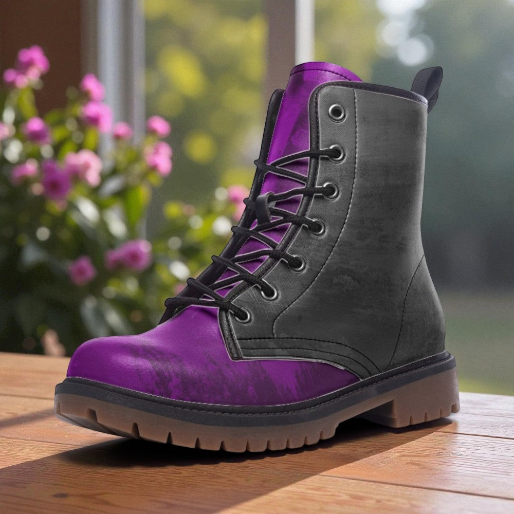 A purple and gray combat boot is displayed on a wooden surface, with a blurred background of pink flowers.