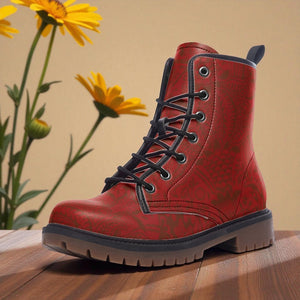 A red and black patterned boot is displayed on a wooden surface, with yellow flowers in the background.