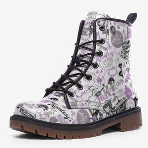 a pair of white and purple boots with skulls on them