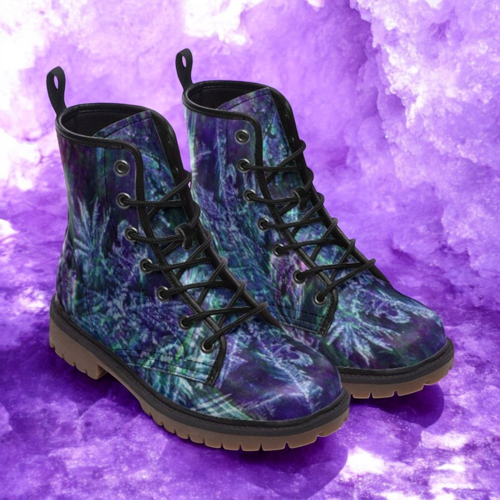 a pair of purple and green boots on a purple background