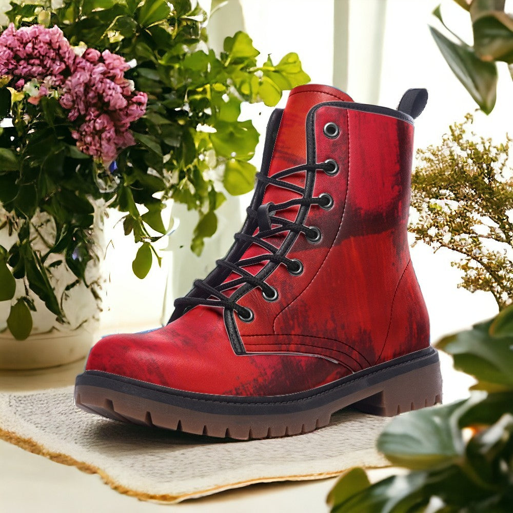 a pair of red boots sitting on top of a table