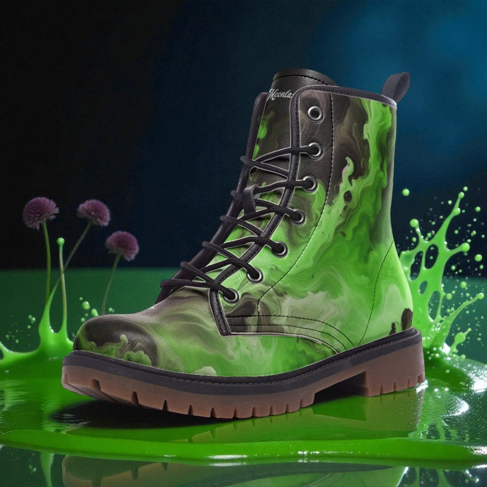 A green and black camouflage boot with a black lace and sole, standing on a green surface with purple flowers and a splash of green liquid behind it.