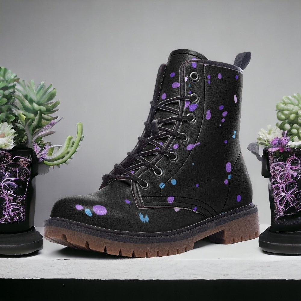 a pair of black boots with purple and blue flowers on them