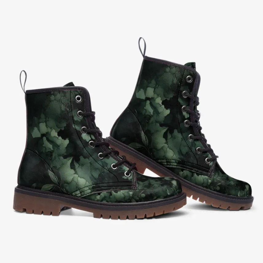 A pair of green camouflage boots with a floral pattern.