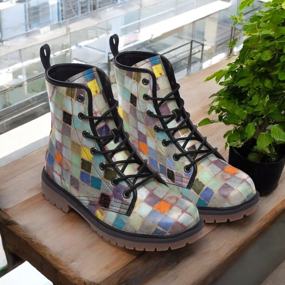 a pair of boots sitting on top of a wooden table