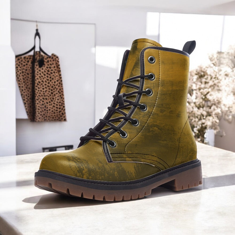 a pair of yellow boots sitting on top of a counter