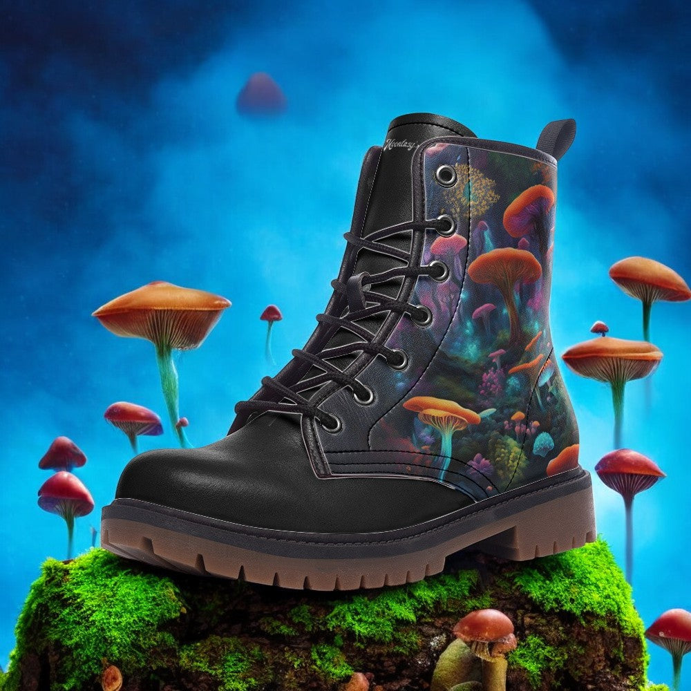 a pair of black boots sitting on top of a moss covered ground