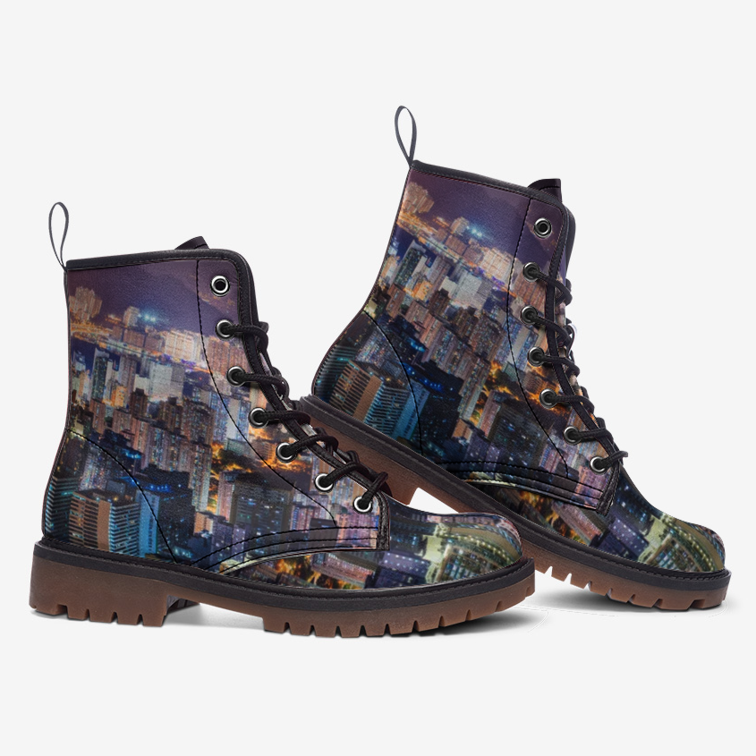 a pair of boots with a city skyline on them