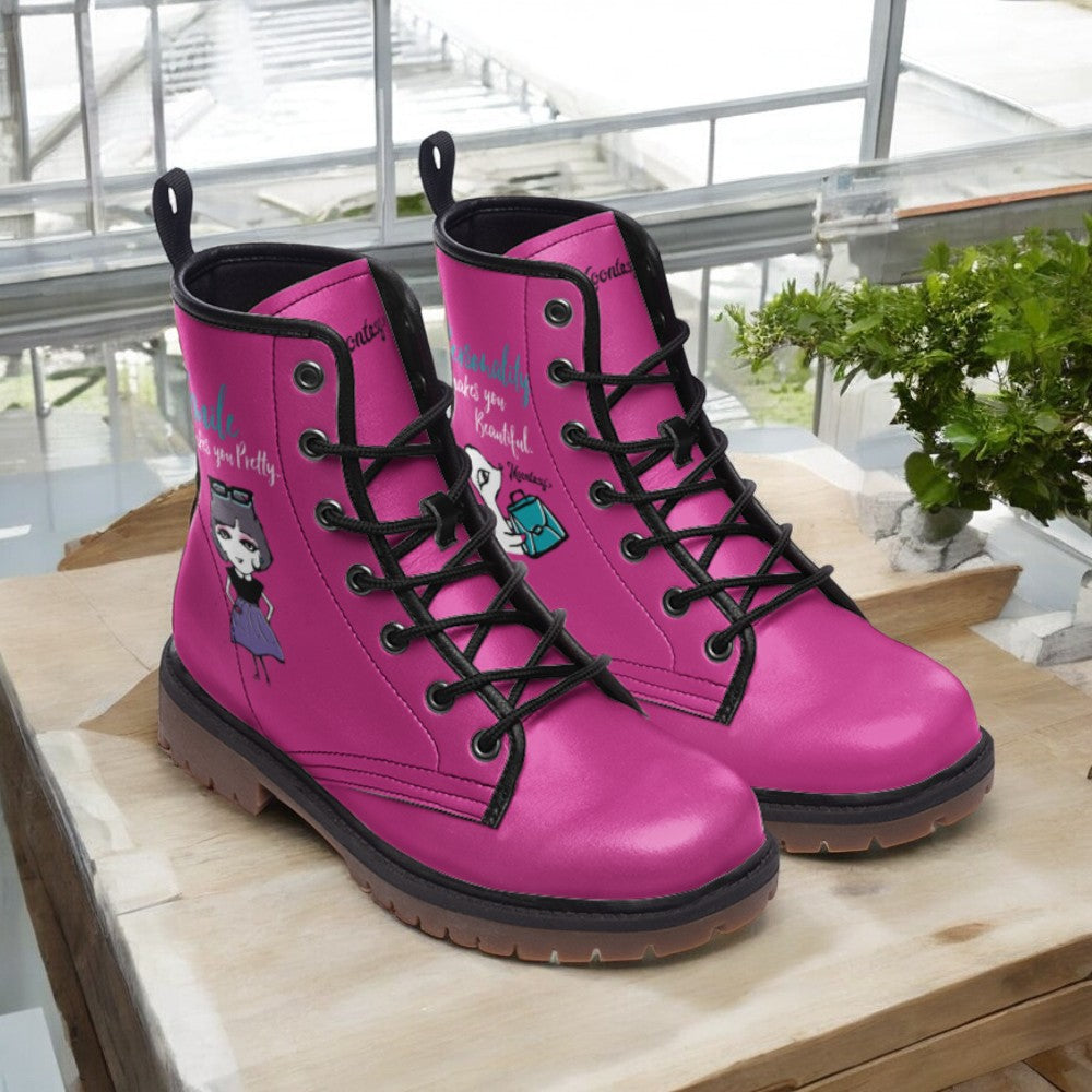 a pair of pink boots sitting on top of a wooden table