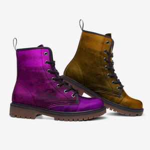 a pair of purple and brown boots sitting next to each other