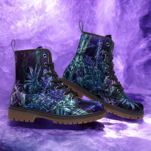 a pair of purple and green boots on a purple background