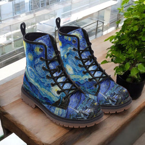a pair of boots sitting on top of a wooden table
