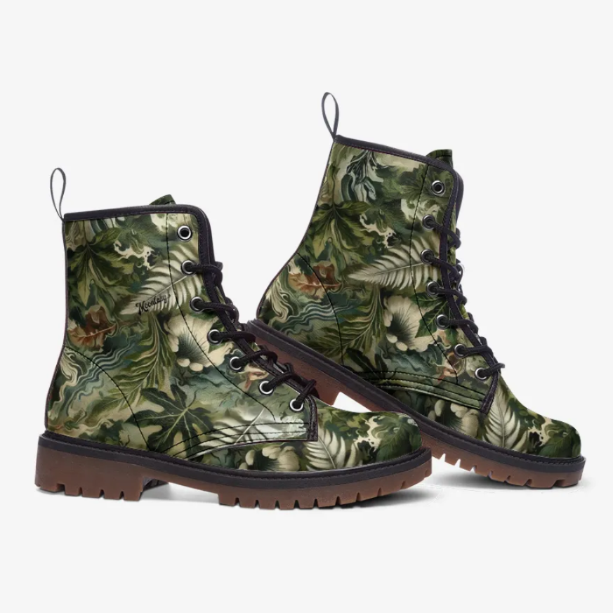 A pair of camouflage-patterned boots with a tropical leaf design.