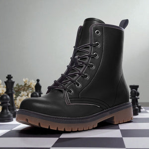 A black leather boot with a lace-up design sits on a checkered surface, surrounded by chess pieces.