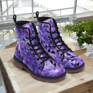 a pair of purple boots sitting on top of a wooden table