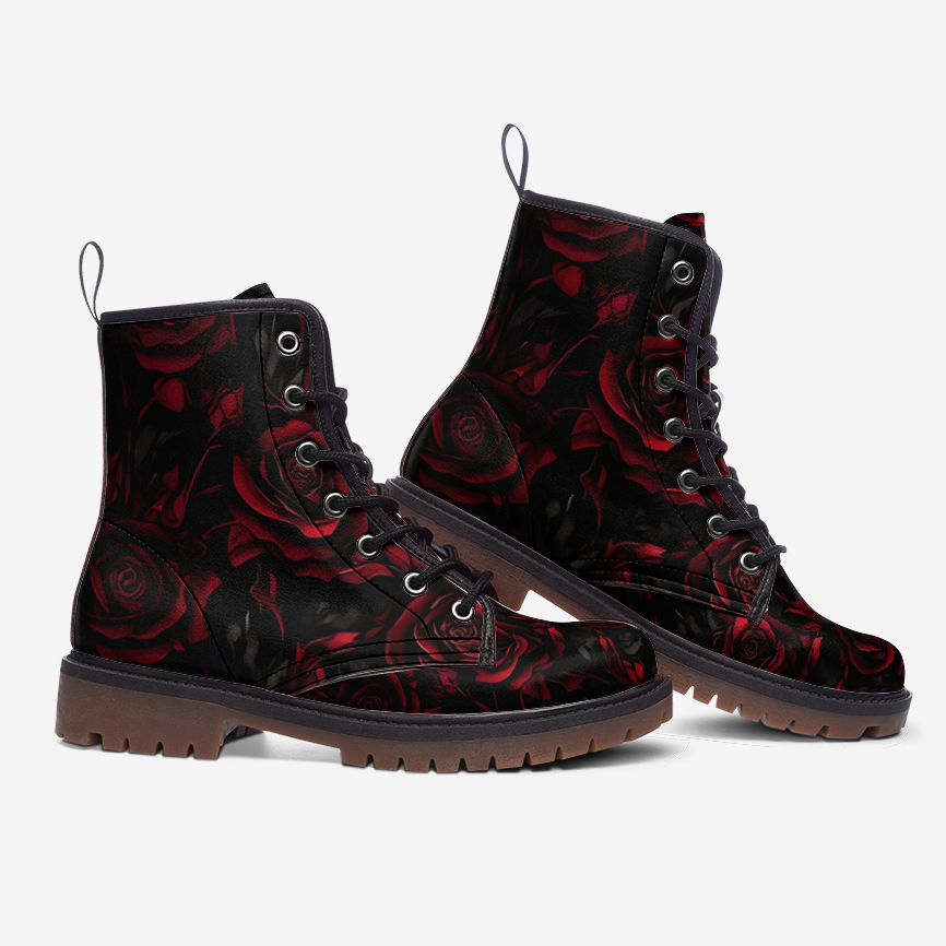 a pair of black and red boots with roses on them