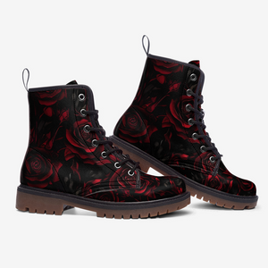 a pair of black and red boots with roses on them